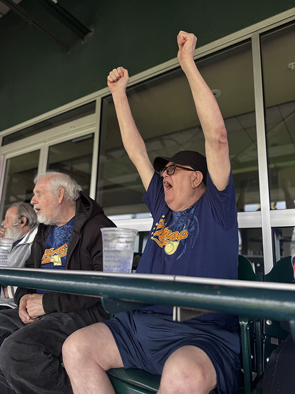 elderly white man cheering at Detroit Tigers game in April 2026